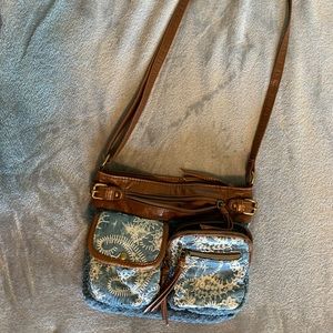 jean and brown leather patterned crossbody purse